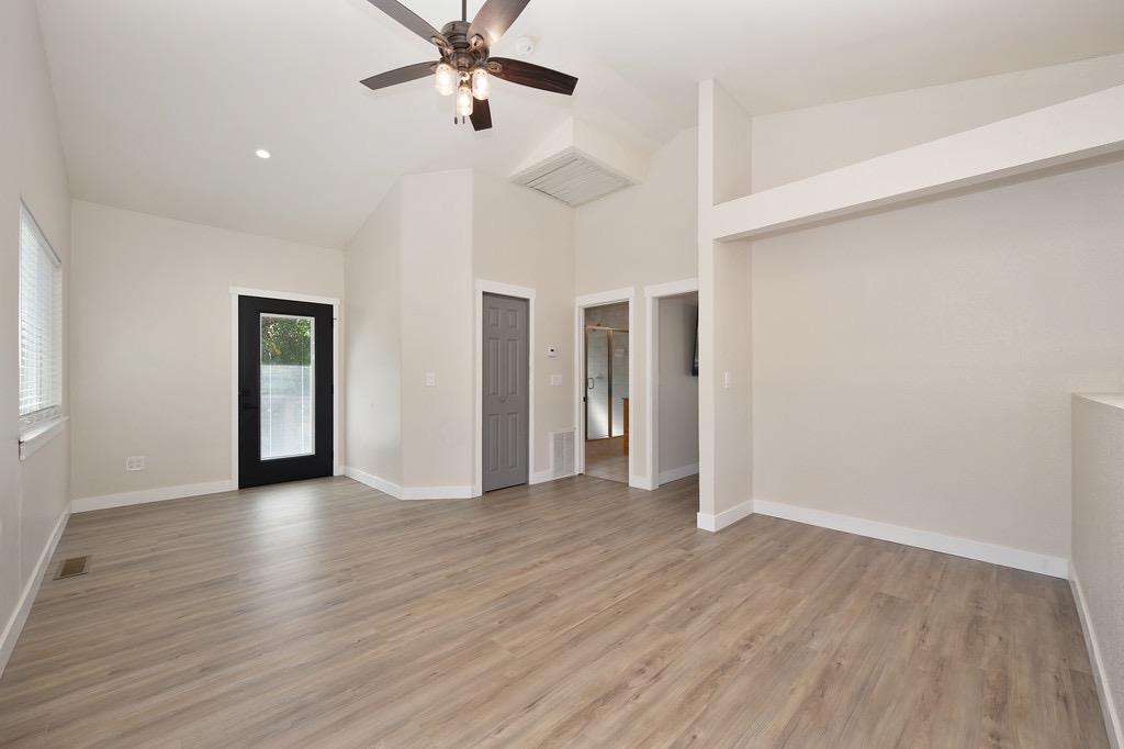 5205 Rooster Lane Somerset, CA 95684 - Photo 63 of 98 a view of a livingroom with wooden floor and a ceiling fan