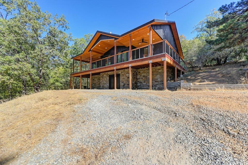 5205 Rooster Lane Somerset, CA 95684 - Photo 7 of 98 a front view of a house with a yard