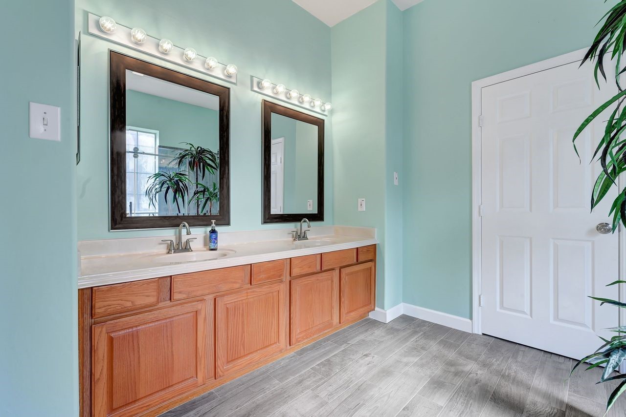 19126 South Rim Trail Spring, TX 77388 - Photo 15 of 21 a bathroom with a double vanity sink and a mirror
