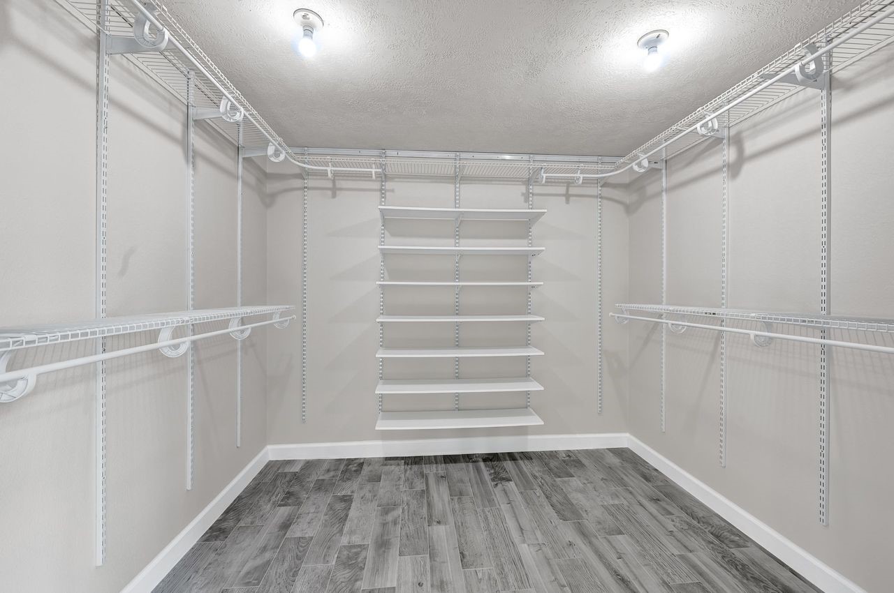19126 South Rim Trail Spring, TX 77388 - Photo 17 of 21 a view of walk in closet with empty racks