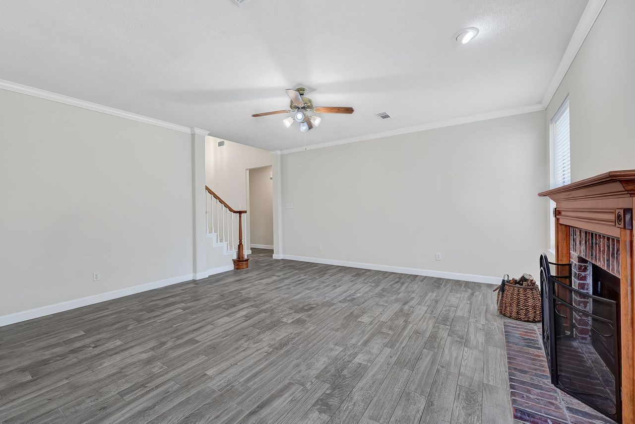 19126 South Rim Trail Spring, TX 77388 - Photo 7 of 21 a view of empty room with wooden floor and fan
