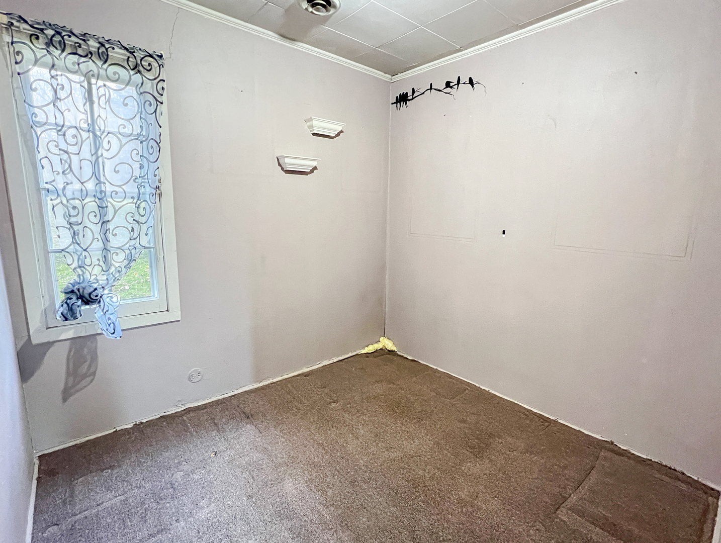 10 Hilltop Road Cary, IL 60013 - Photo 4 of 13 a view of a small space with a window and a fan