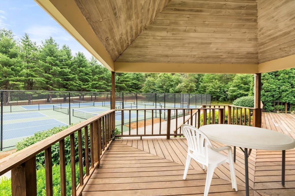 200 Ridgefield Circle, Unit C Clinton, MA 01510 - Photo 23 of 35 a view of a balcony with wooden floor and outdoor space