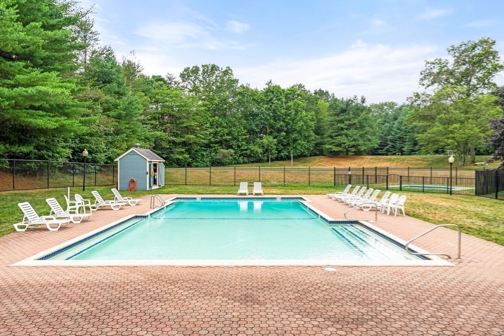 200 Ridgefield Circle, Unit C Clinton, MA 01510 - Photo 27 of 35 a view of a swimming pool with a lake view