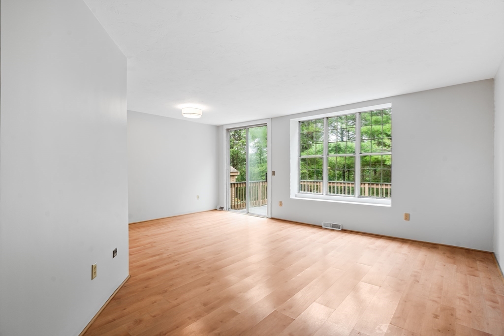 200 Ridgefield Circle, Unit C Clinton, MA 01510 - Photo 5 of 35 a view of an empty room with a window