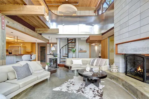 a kitchen with stainless steel appliances granite countertop a refrigerator and a stove