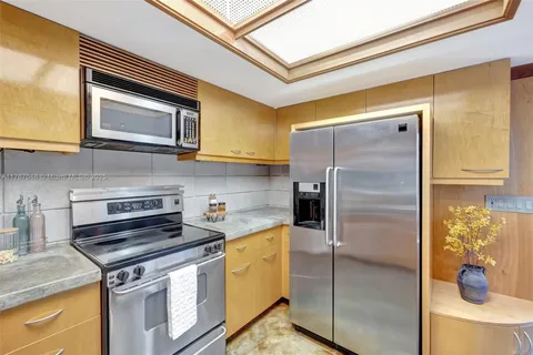 a en suite bathroom with a sink a mirror and a shower