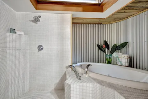 an entryway with fireplace and a mirror