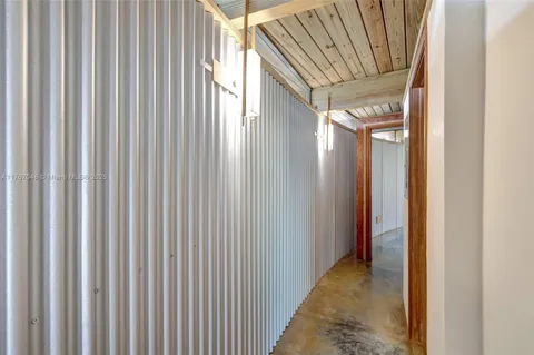 a view of a swimming pool with a yard