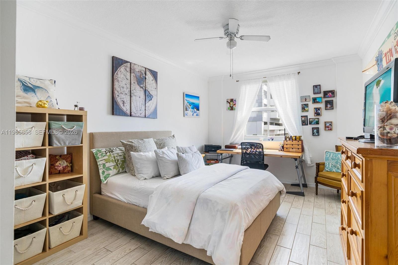 9172 Collins Avenue, Unit 210 Surfside, FL 33154 - Photo 16 of 41 a bedroom with a bed furniture and decor