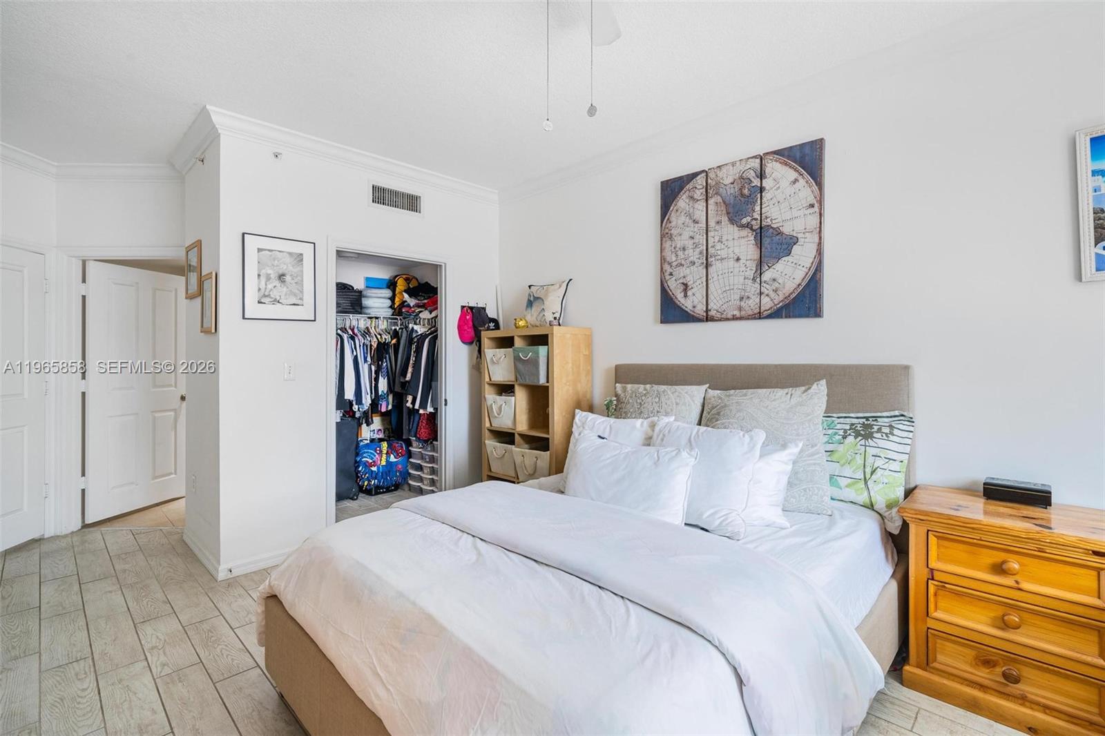 9172 Collins Avenue, Unit 210 Surfside, FL 33154 - Photo 18 of 41 a bed room with a bed and a closet