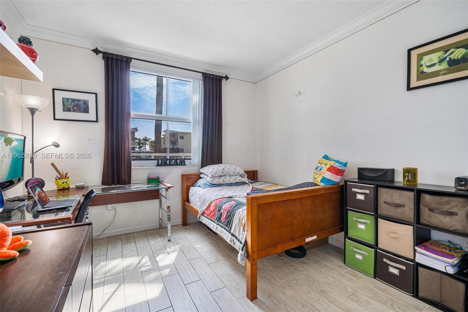 9172 Collins Avenue, Unit 210 Surfside, FL 33154 - Photo 21 of 41 a bed room with furniture and a window