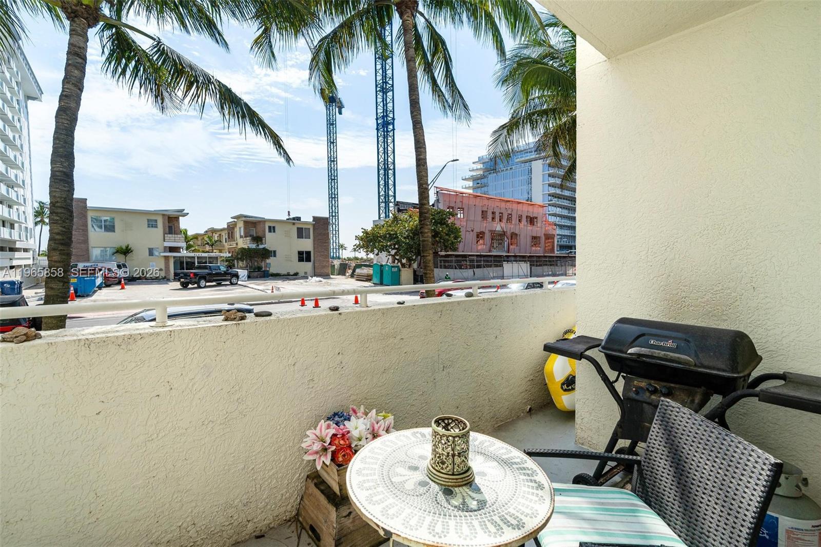9172 Collins Avenue, Unit 210 Surfside, FL 33154 - Photo 5 of 41 a dining room with furniture and a potted plant