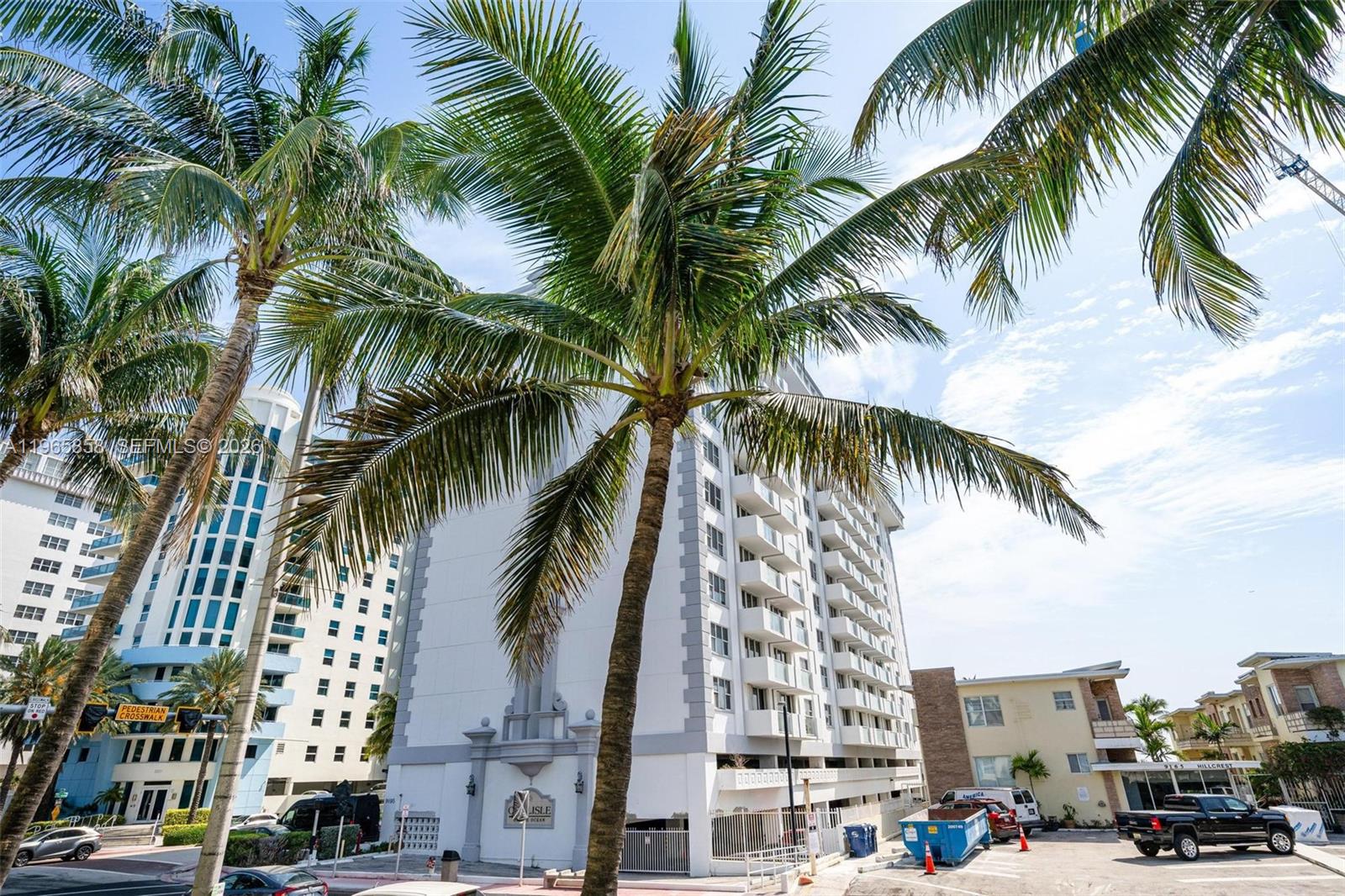 9172 Collins Avenue, Unit 210 Surfside, FL 33154 - Photo 8 of 41 a view of a palm and tall buildings
