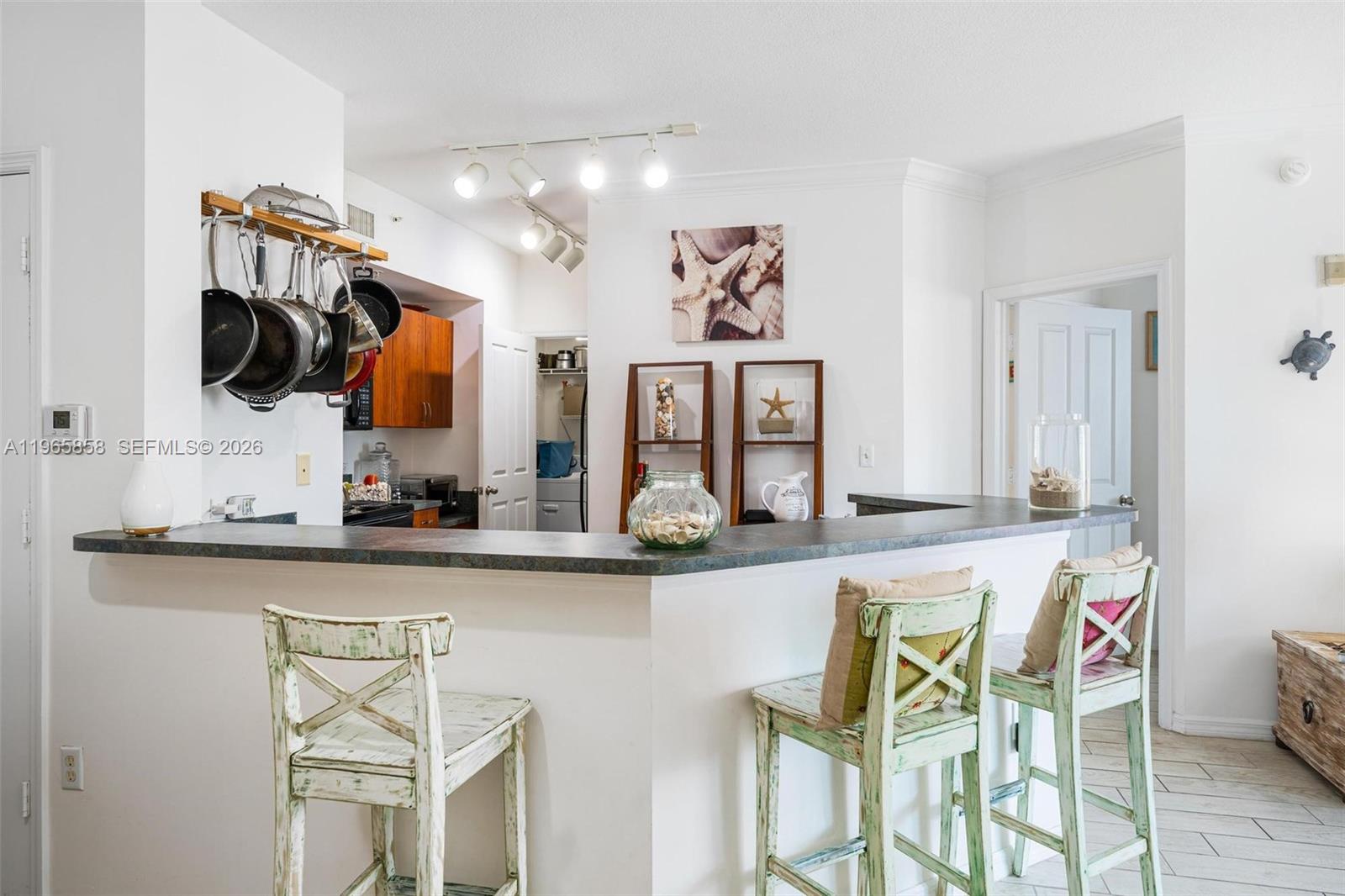 9172 Collins Avenue, Unit 210 Surfside, FL 33154 - Photo 10 of 41 a kitchen with stainless steel appliances granite countertop a sink and cabinets