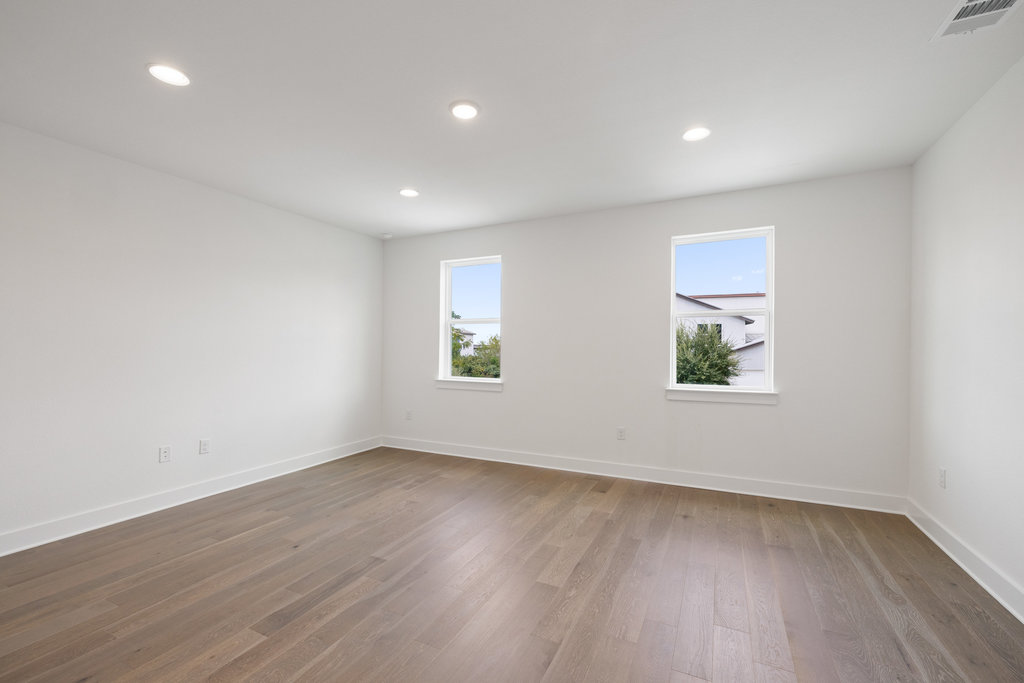 7321 Annette Cove Austin, TX 78724 - Photo 11 of 40 Light-filled secondary bedroom ideal for guests or family.
