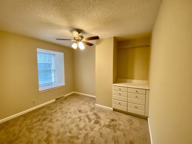 a view of walk in closet with window