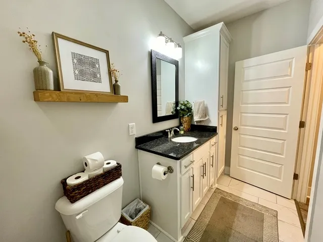 a view of an empty room and wooden floor