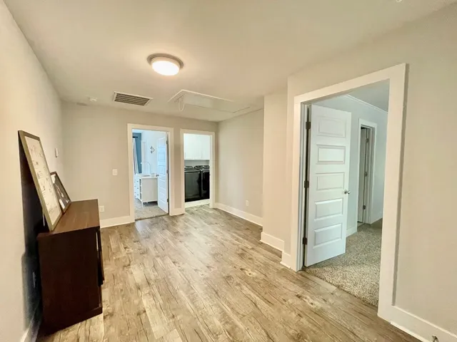 a bedroom with a bed and ceiling fan