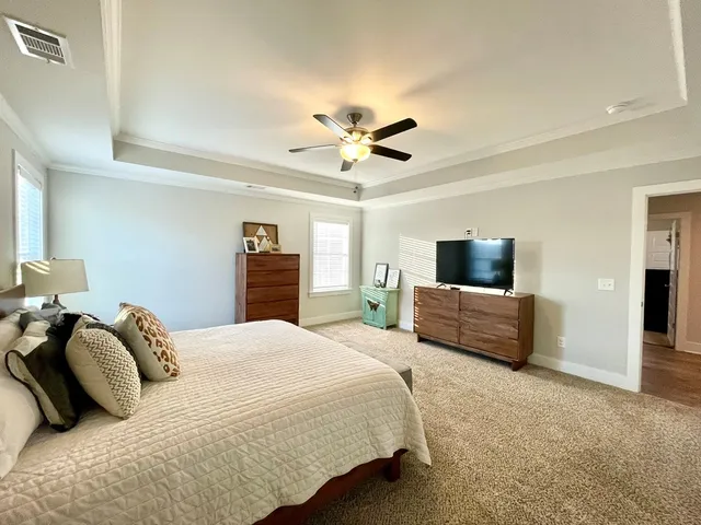 a spacious bathroom with a granite countertop sink and a mirror