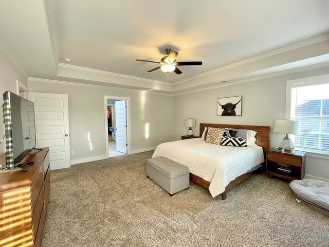 a spacious bathroom with a double vanity sink and a mirror