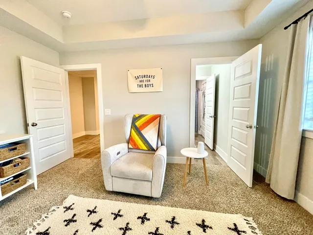 a bedroom with a bed and a chair