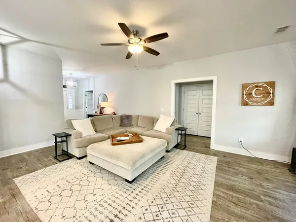 a living room with furniture fireplace and flat screen tv