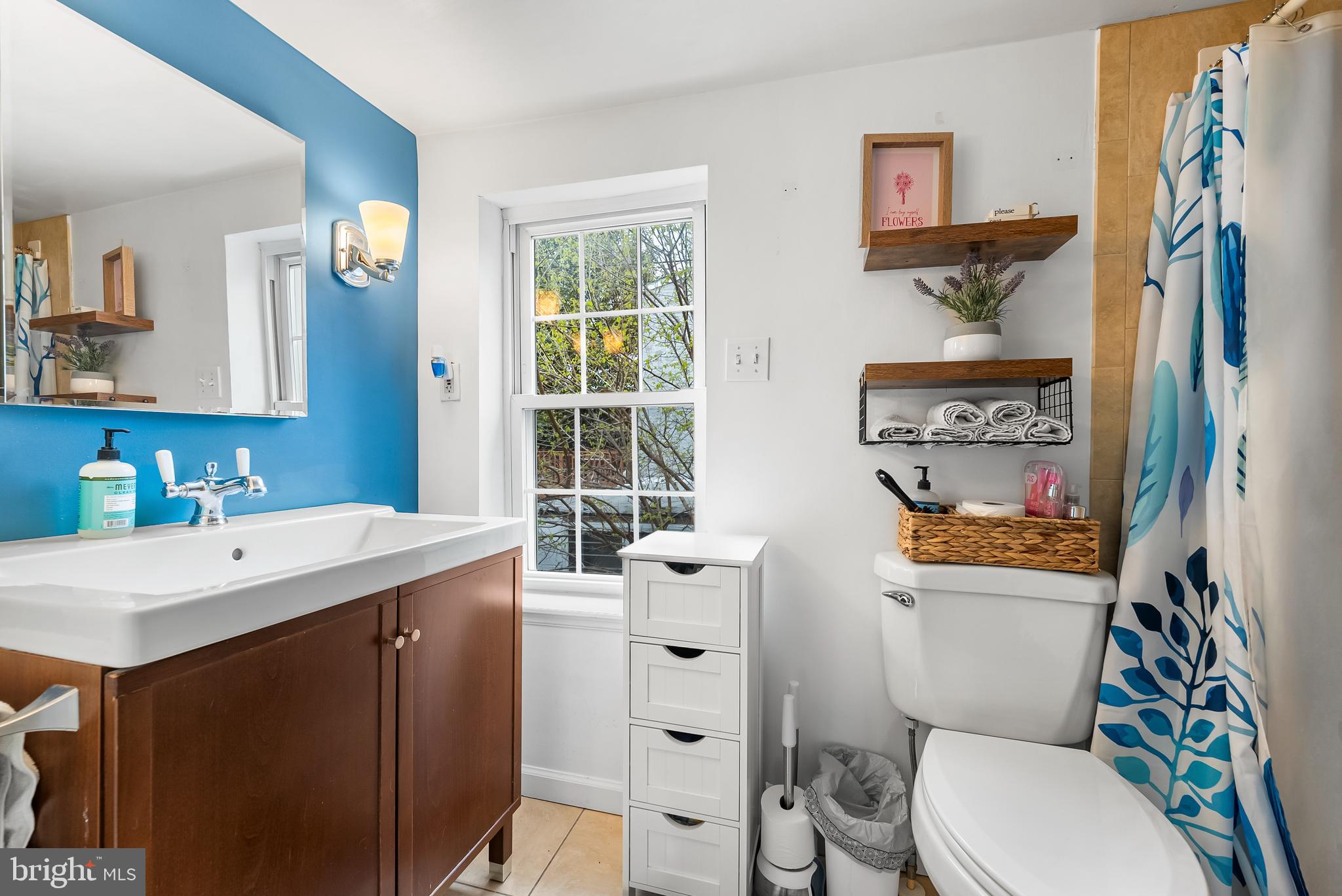 1812 Lancaster Street Baltimore, MD 21231 - Photo 17 of 38 a bathroom with a sink mirror vanity and toilet