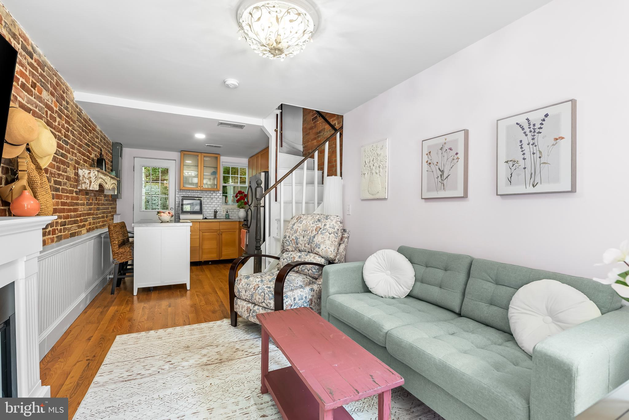1812 Lancaster Street Baltimore, MD 21231 - Photo 2 of 38 a living room with furniture and wooden floor