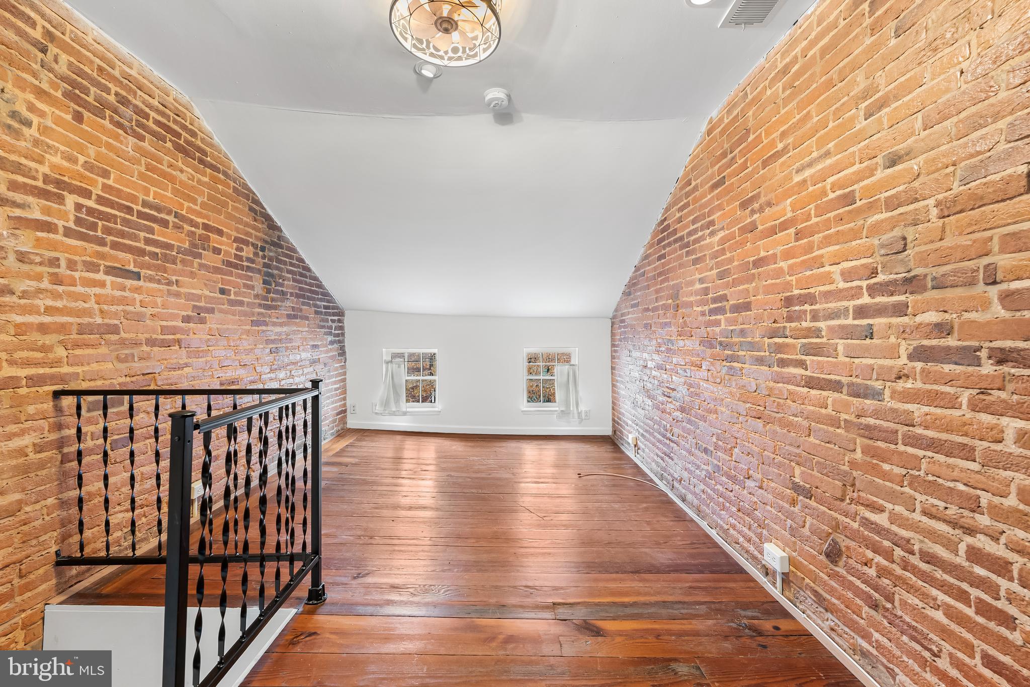 1812 Lancaster Street Baltimore, MD 21231 - Photo 22 of 38 a view of a hallway with wooden floor