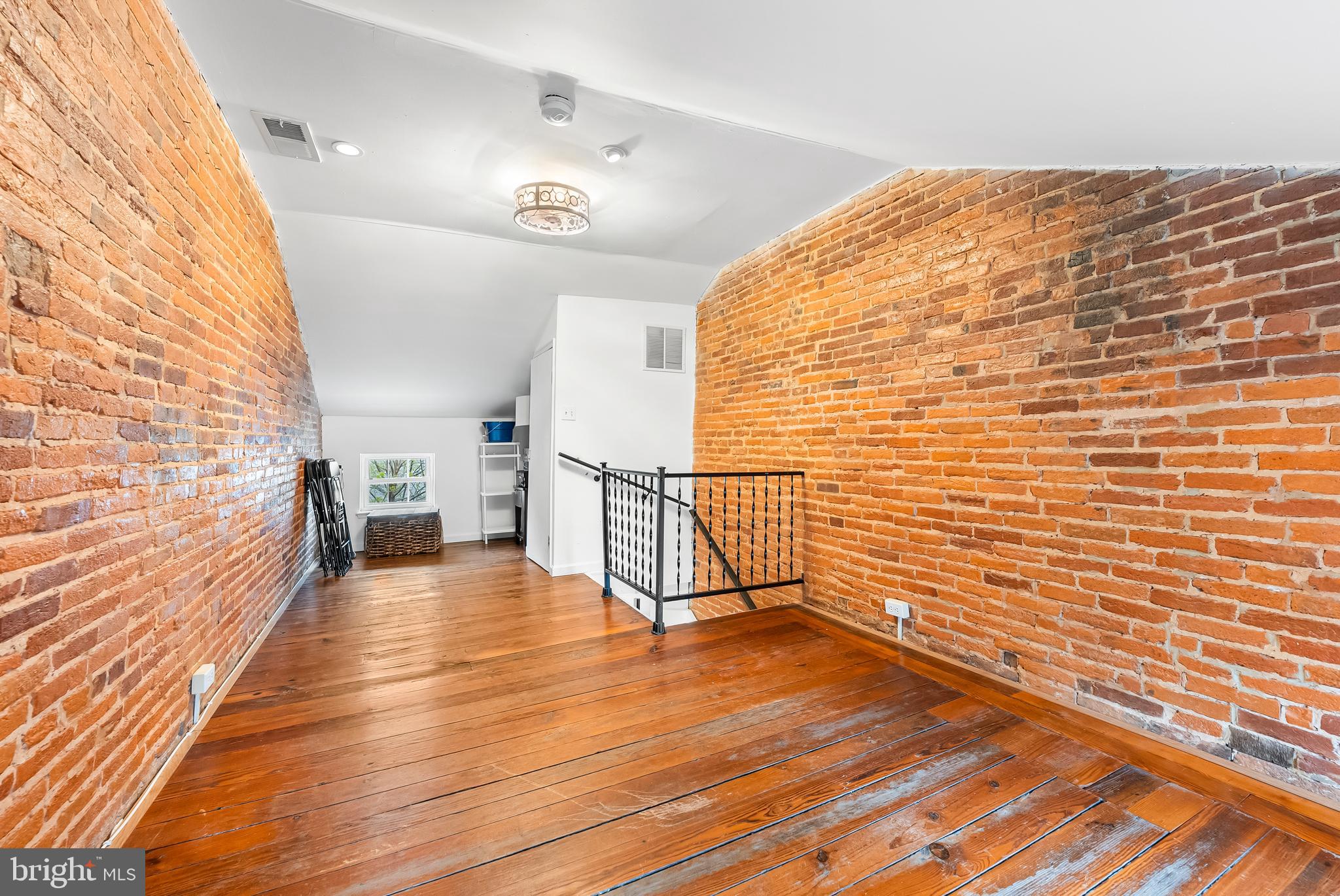 1812 Lancaster Street Baltimore, MD 21231 - Photo 24 of 38 a view of a room with wooden floor and staircase
