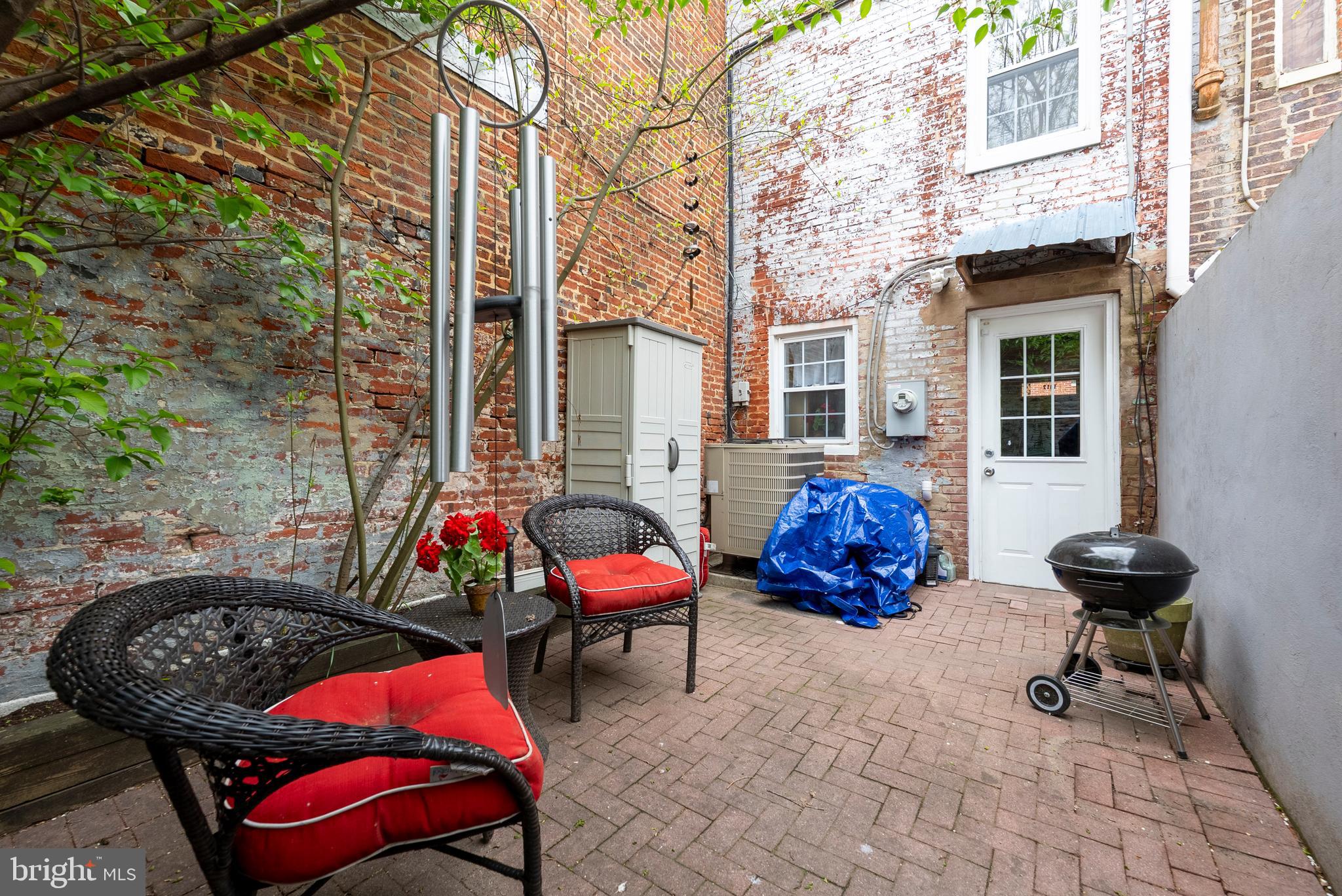 1812 Lancaster Street Baltimore, MD 21231 - Photo 28 of 38 a backyard of a house with outdoor seating