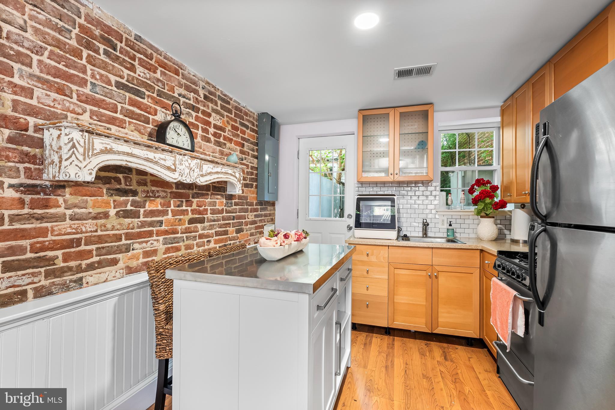1812 Lancaster Street Baltimore, MD 21231 - Photo 7 of 38 a kitchen that has a sink stove and refrigerator
