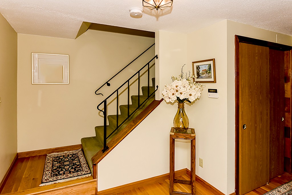 86 Leland Road Boston, MA 02467 - Photo 8 of 18 a view of entryway with wooden floor