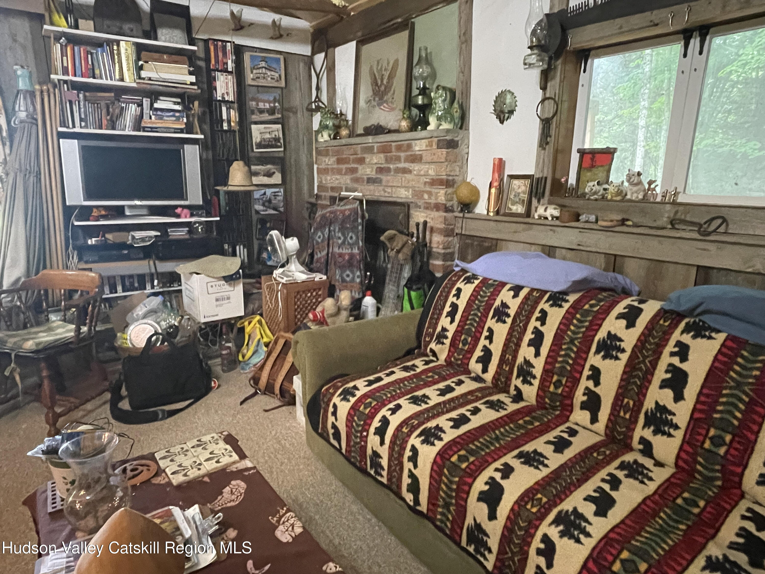 367 Rainbow Hill Road Andes, NY 13731 - Photo 12 of 30 a bedroom with a bed and a flat screen tv