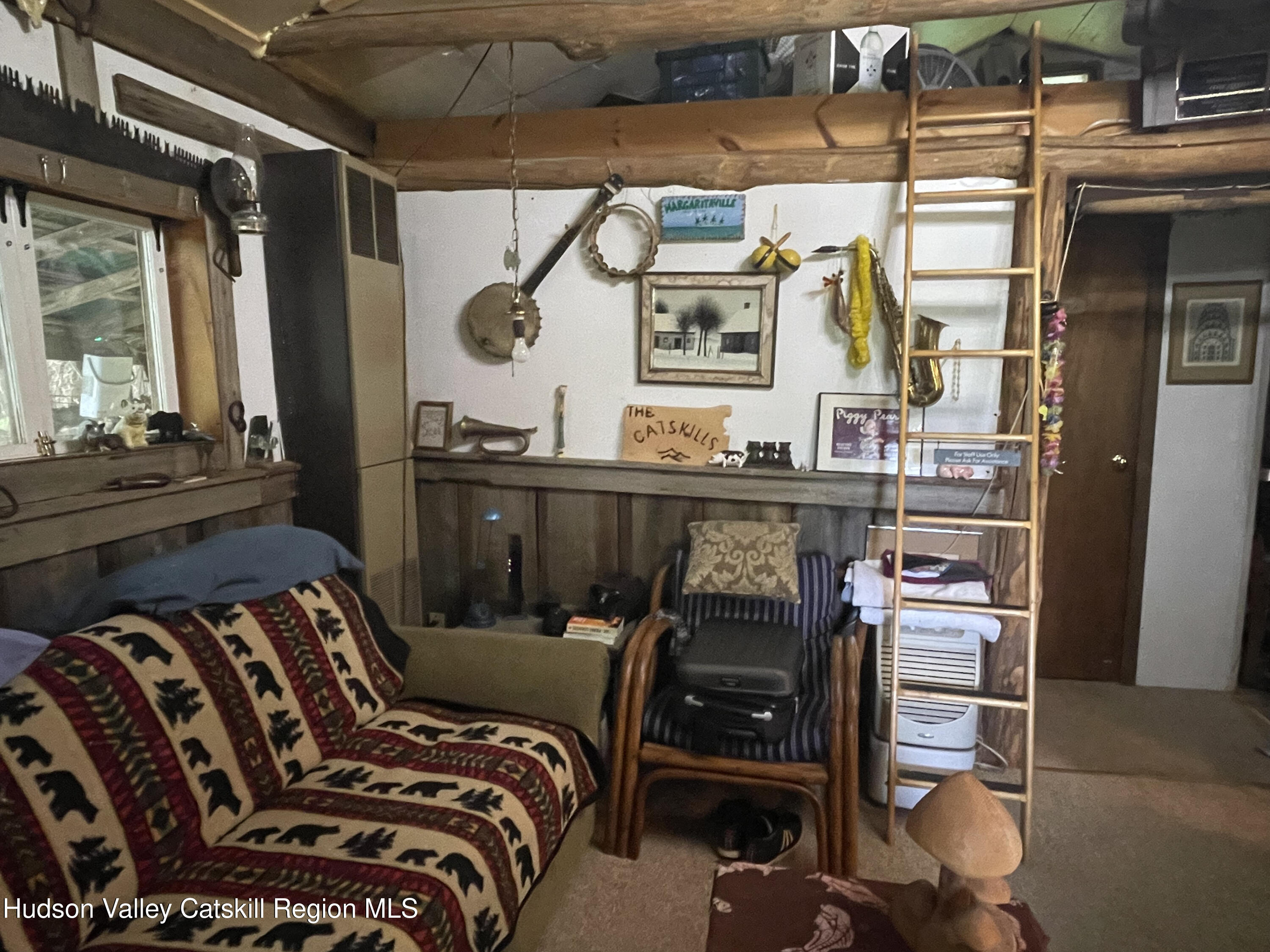 367 Rainbow Hill Road Andes, NY 13731 - Photo 13 of 30 a bedroom with a bed and wooden floor