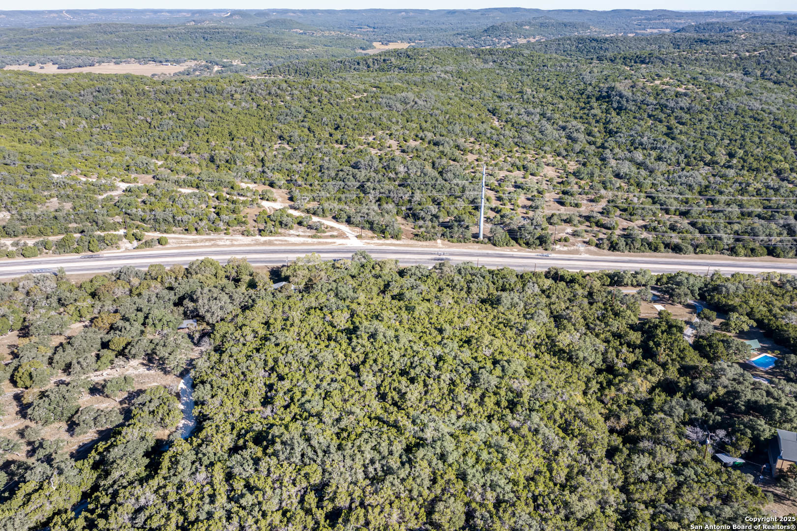 18961 Bandera Road Helotes, TX 78023 - Photo 5 of 5 a view of a field with an ocean view