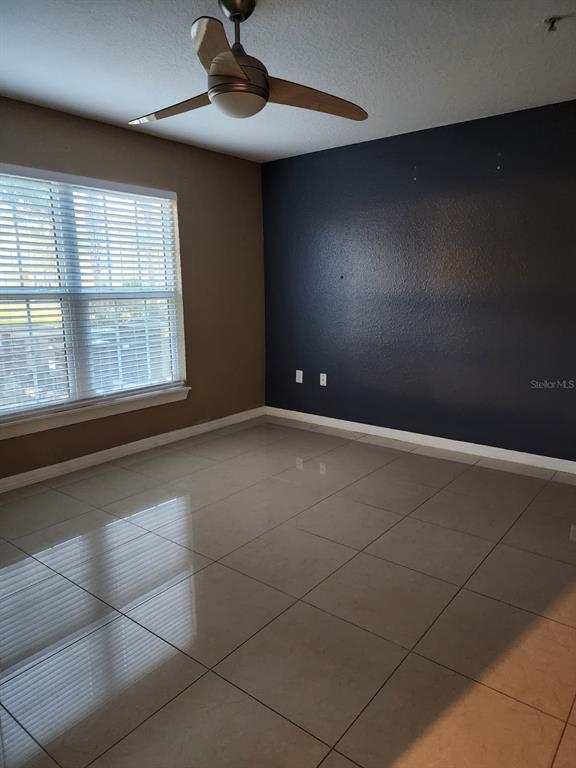 5483 Vineland Road, Unit 10107 Orlando, FL 32811 - Photo 13 of 17 a view of an empty room with a window