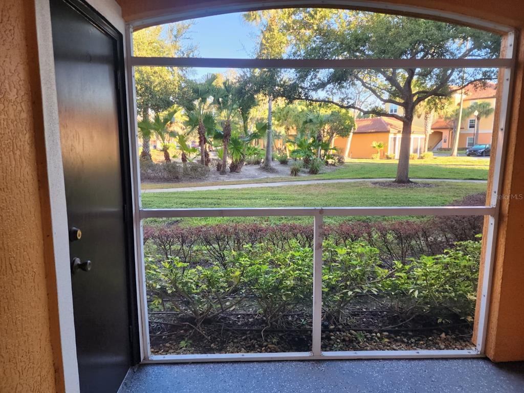 5483 Vineland Road, Unit 10107 Orlando, FL 32811 - Photo 17 of 17 a view of backyard with green space and deck