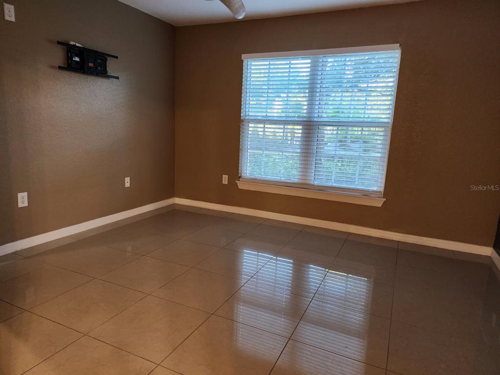5483 Vineland Road, Unit 10107 Orlando, FL 32811 - Photo 8 of 17 a view of an empty room with a window