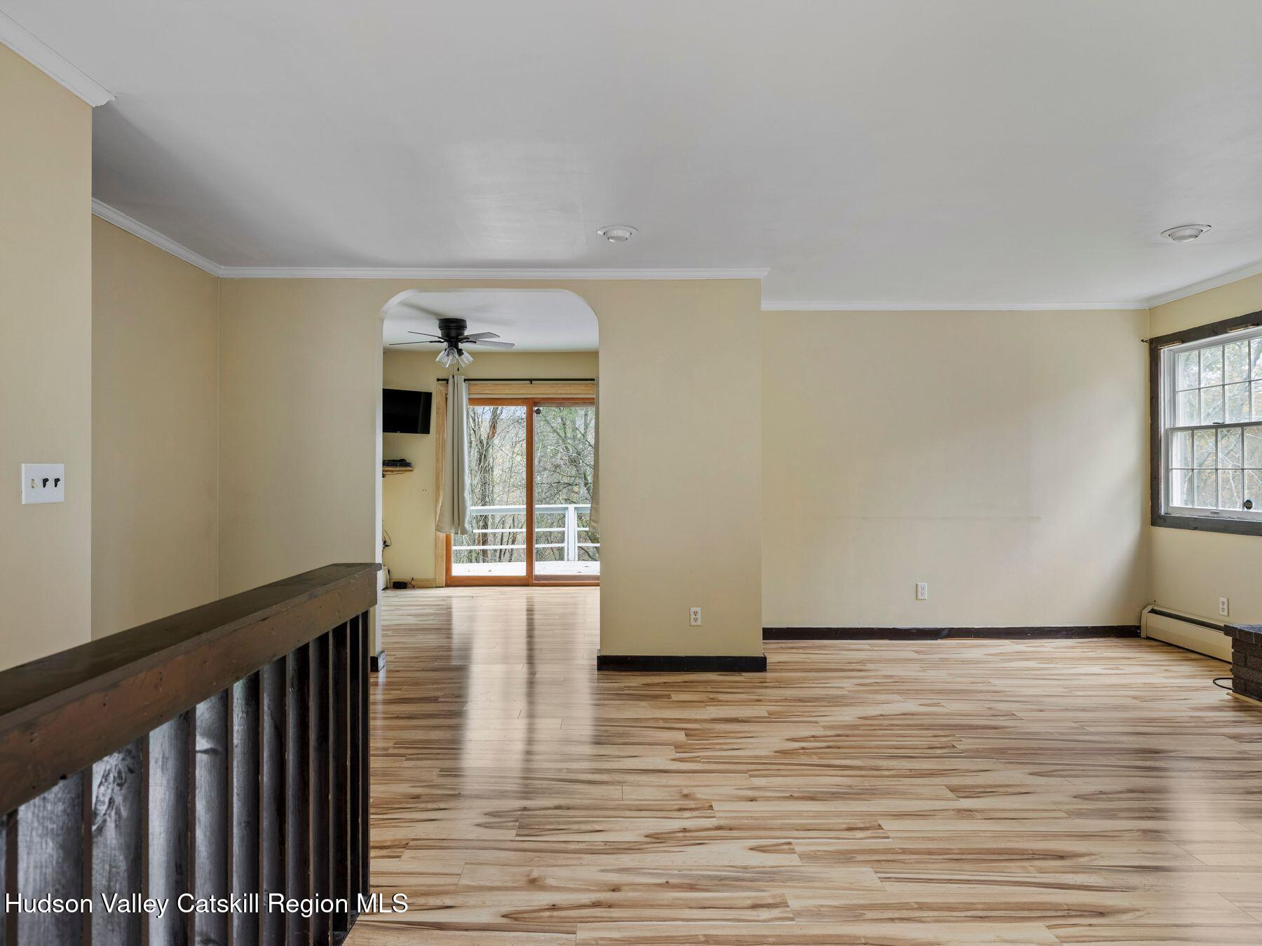 317 Mitchell Hollow Road Windham, NY 12496 - Photo 15 of 41 a view of an empty room with window and wooden floor