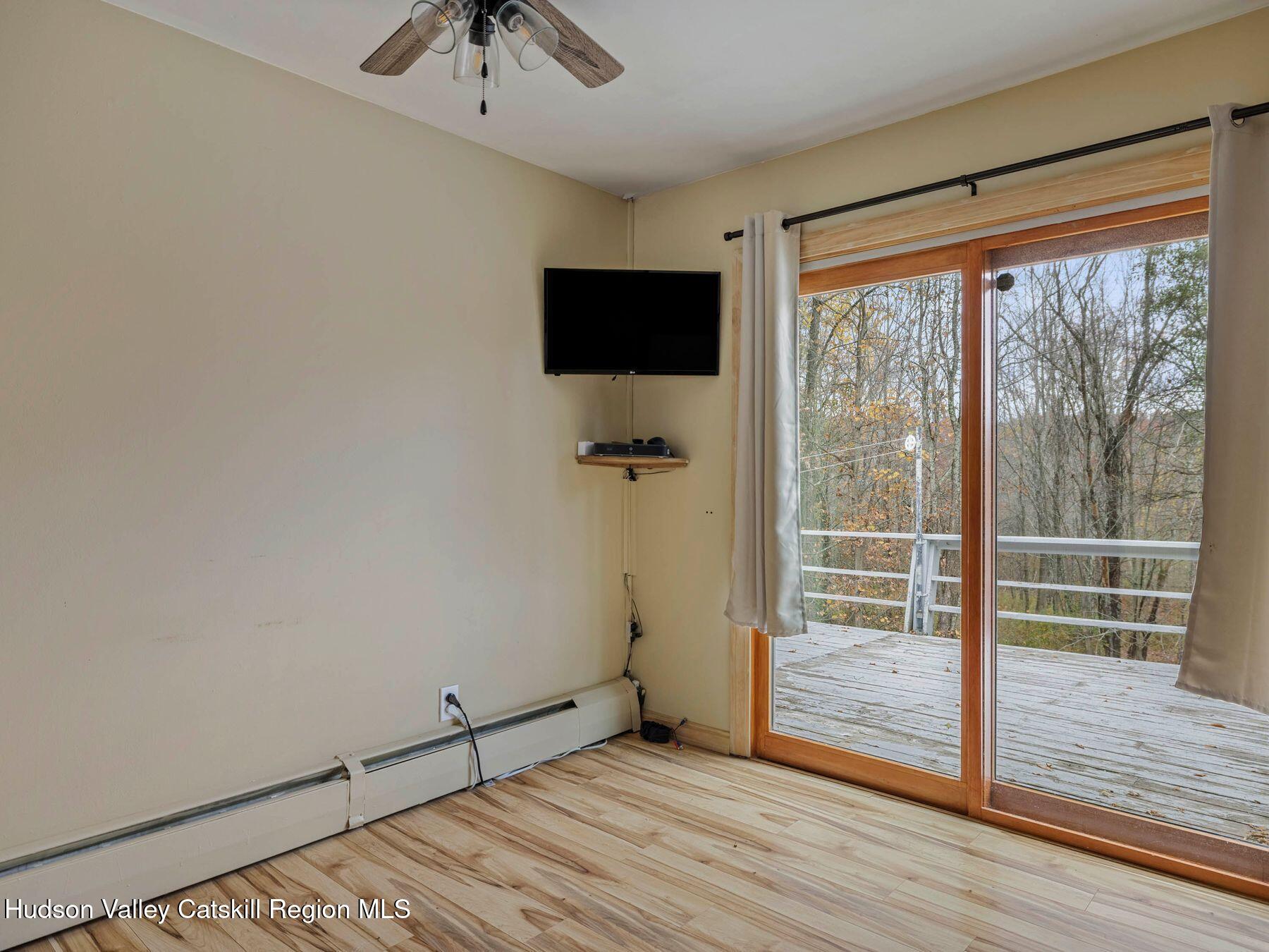 317 Mitchell Hollow Road Windham, NY 12496 - Photo 20 of 41 a view of a room with wooden floor and balcony