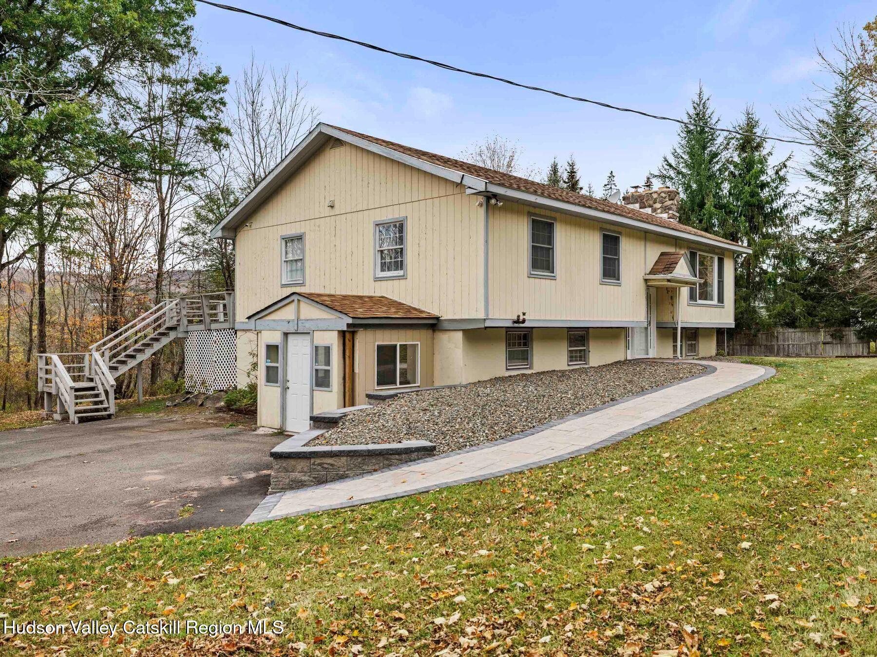 317 Mitchell Hollow Road Windham, NY 12496 - Photo 3 of 41 a front view of a house with a yard