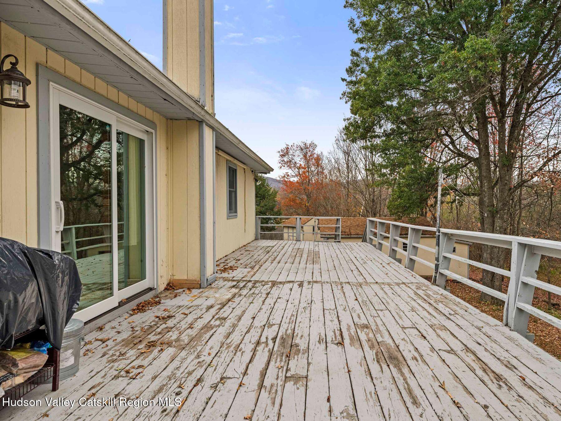 317 Mitchell Hollow Road Windham, NY 12496 - Photo 38 of 41 a view of balcony with wooden floor and fence