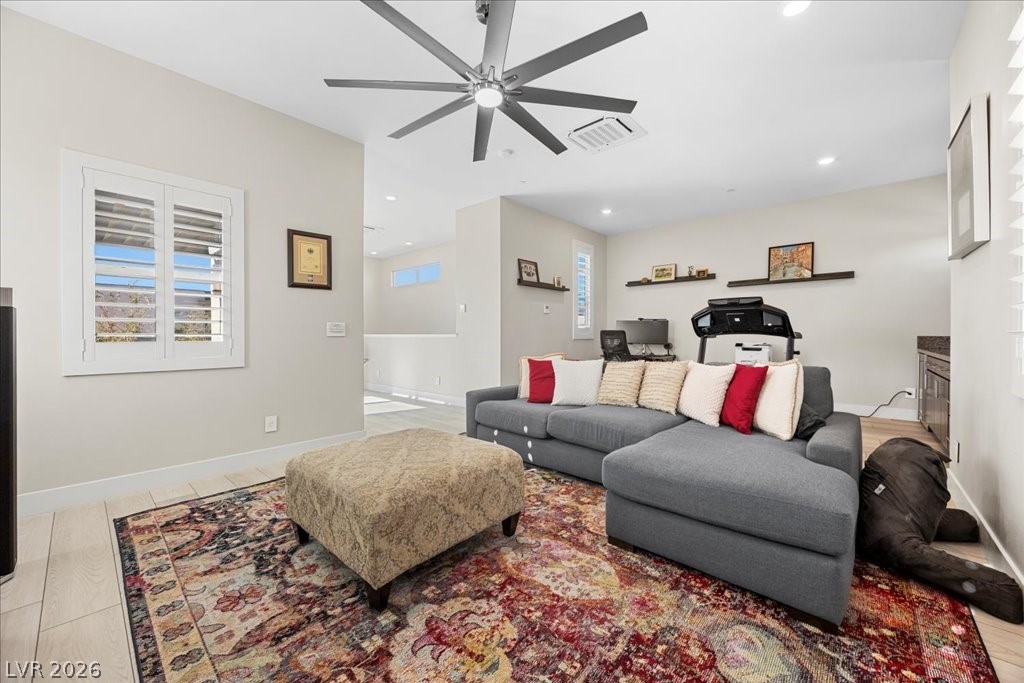 4262 Swift Street Las Vegas, NV 89135 - Photo 48 of 75 Living room featuring ceiling fan and recessed lighting