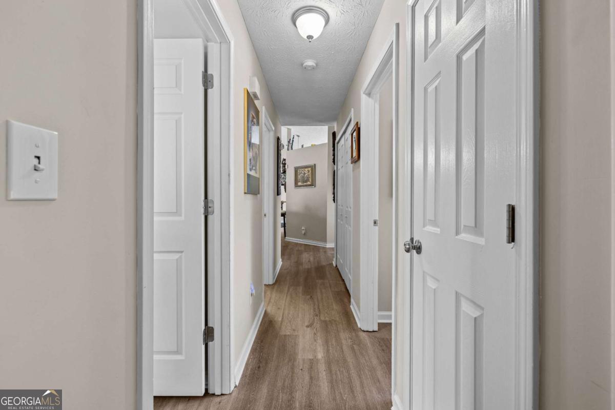 6324 Amberly Road Rex, GA 30273 - Photo 21 of 22 a view of hallway with wooden floor