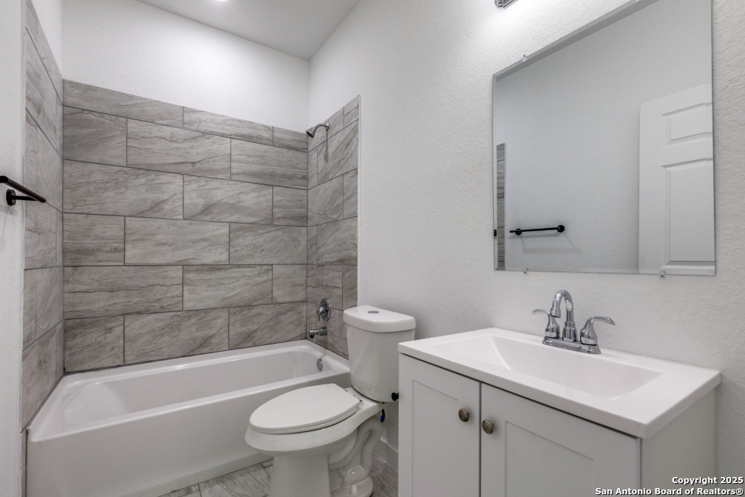 5415 Ingram Road, Unit 1209 San Antonio, TX 78228 - Photo 10 of 10 a bathroom with a sink toilet and shower