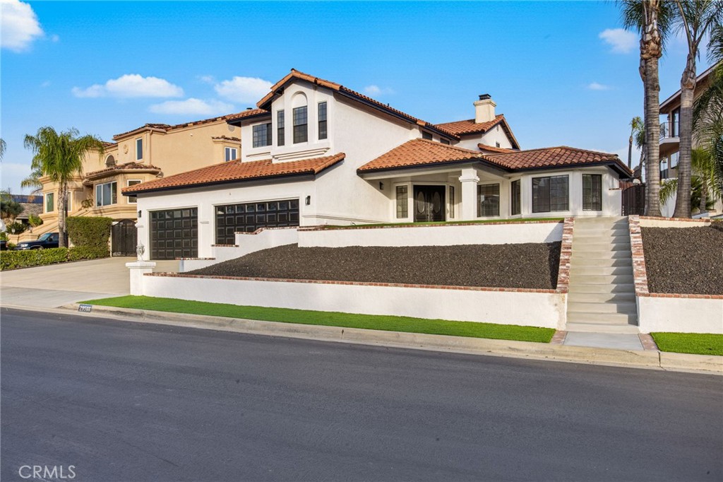 29566 Big Range Road, Unit 1 Canyon Lake, CA 92587 - Photo 1 of 55 a front view of a house with a garden and yard