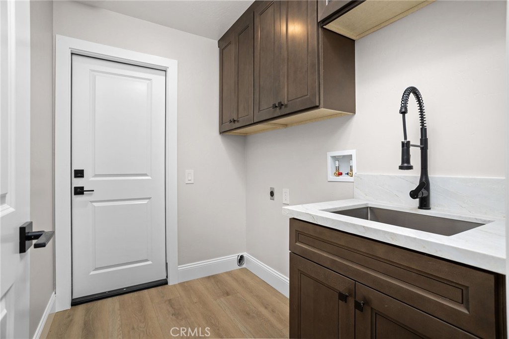 29566 Big Range Road, Unit 1 Canyon Lake, CA 92587 - Photo 17 of 55 a kitchen with a sink and cabinets