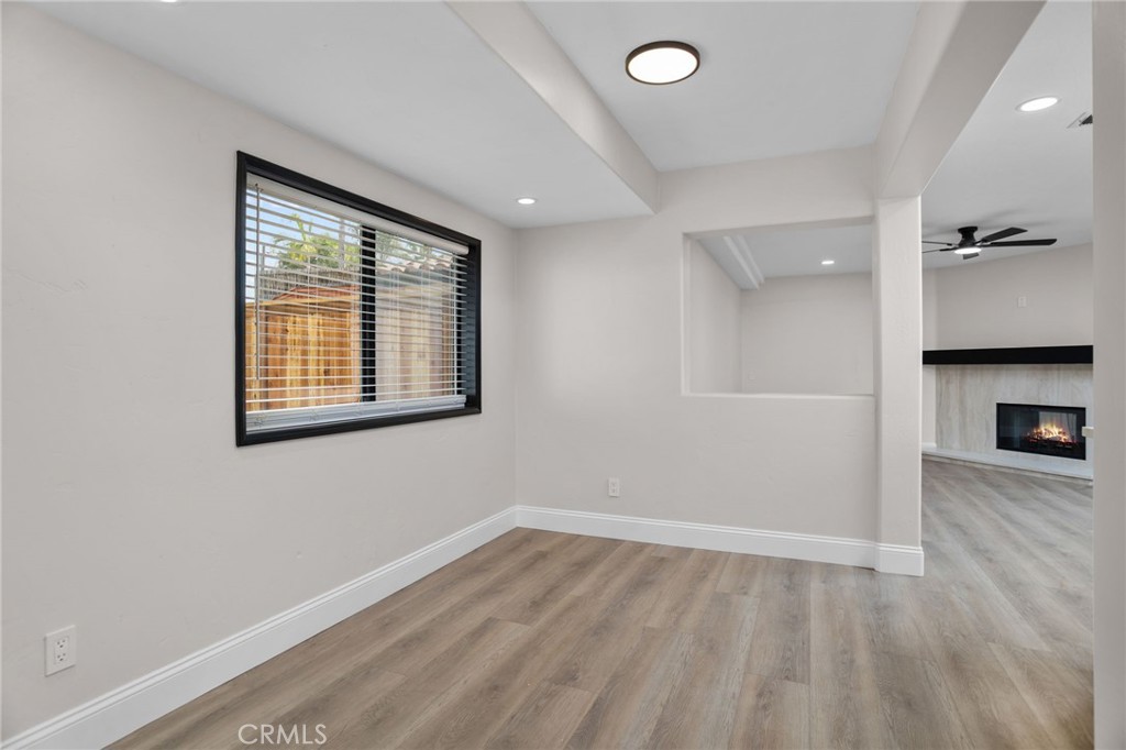 29566 Big Range Road, Unit 1 Canyon Lake, CA 92587 - Photo 25 of 55 wooden floor in an empty room with a window